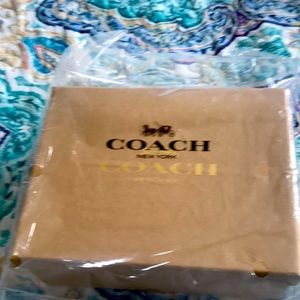 Brand new coach  accessory bag it’s small for like  head ties  chapstick